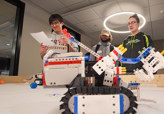 image of students with robots